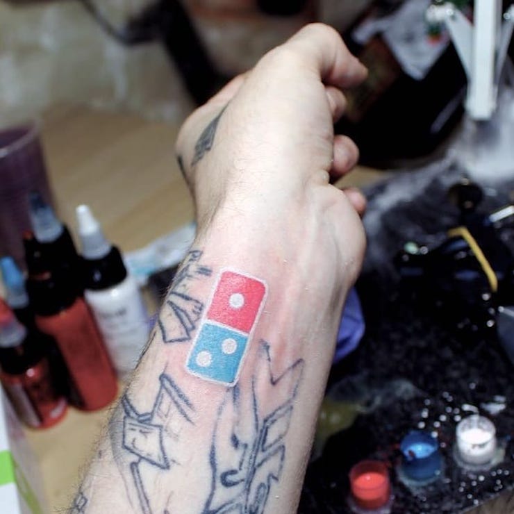 In Russia, Domino's offers 100 years of pizzas to those who tattoo their logo ... and obviously it degenerated