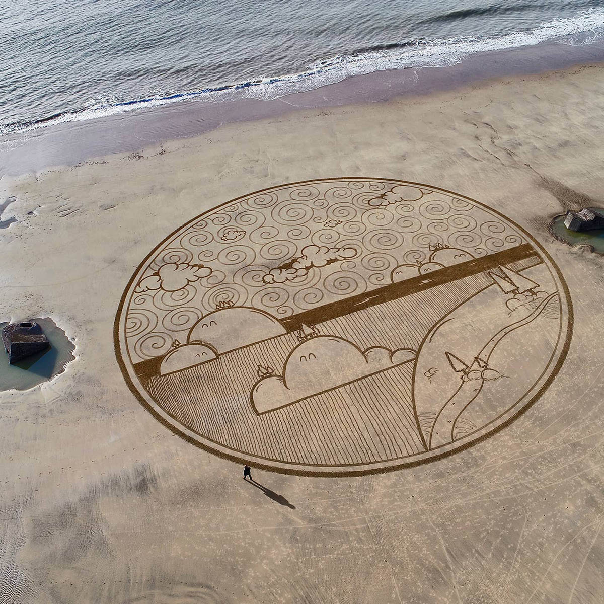 Le dessin sur le sable art effet mer par Jben